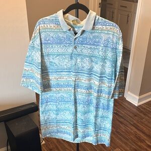 Vintage Men's Blue Patterned Polo Shirt